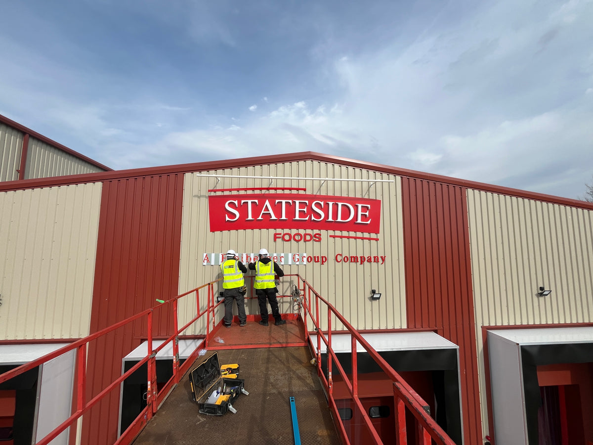 ISP signage installation at an industrial building