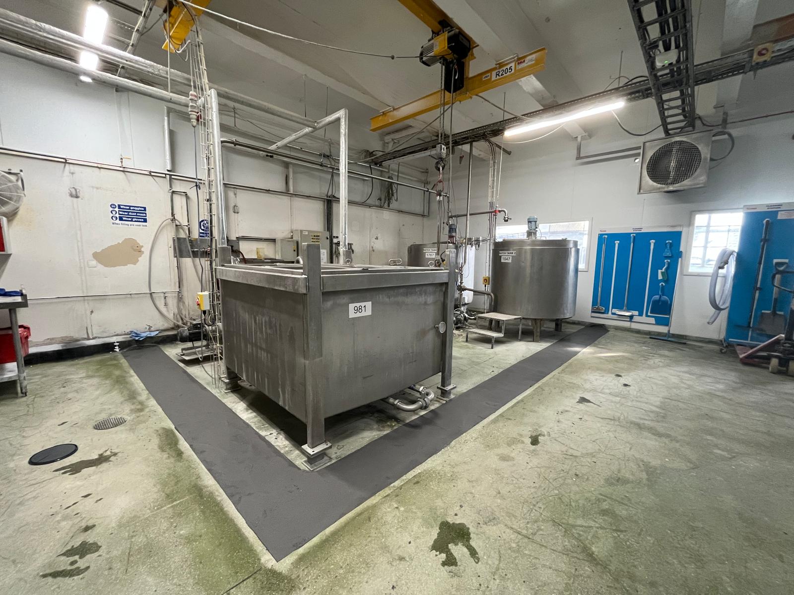 Localised grey polyurethane flooring around industrial tanks